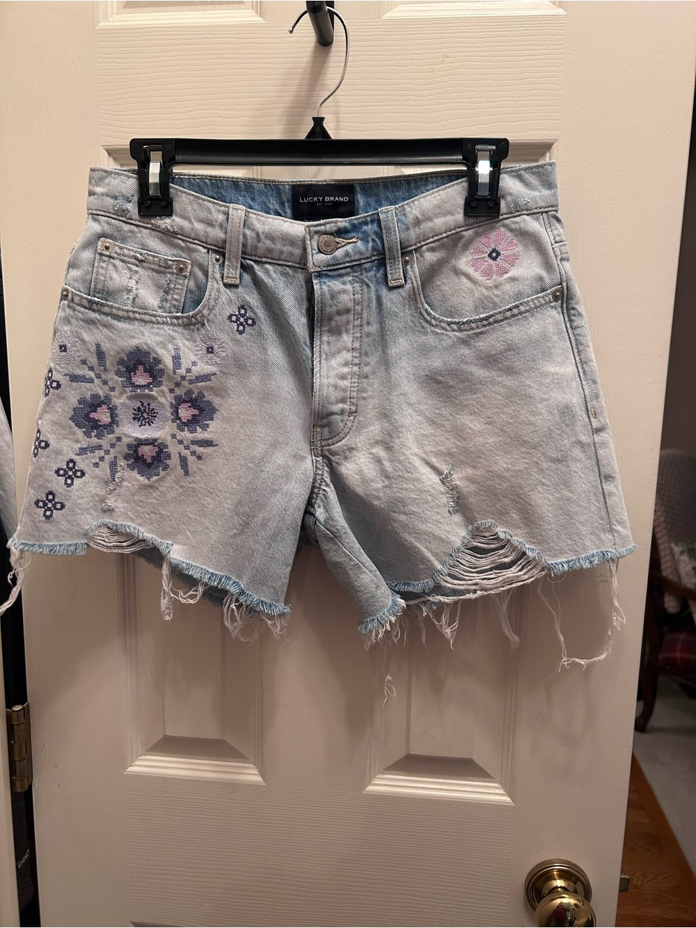 Lucky Brand Light Blue Distressed Jean Shorts w/Flower Detail & Button Fly. 4/27